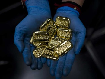 Seirama Komoditas Emas dan Kripto Respons Keputusan The Fed Tahan Suku Bunga