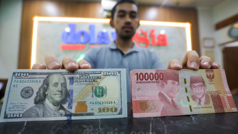 Rupiah Dibuka Lesu Usai BI dan The Fed Tahan Suku Bunga Acuan