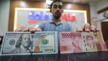 Rupiah Dibuka Lesu Usai BI dan The Fed Tahan Suku Bunga Acuan