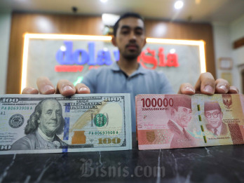 Rupiah Dibuka Lesu Usai BI dan The Fed Tahan Suku Bunga Acuan