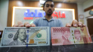 Rupiah Dibuka Lesu Usai BI dan The Fed Tahan Suku Bunga Acuan
